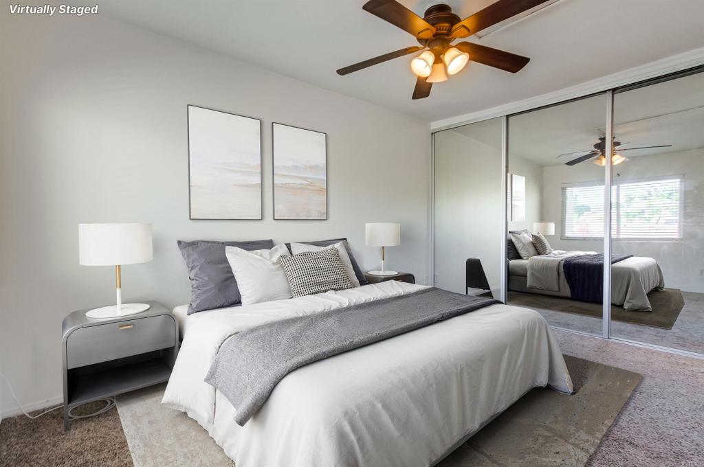 12643 Robison Boulevard, Unit 213 Poway, CA 92064 - Photo 11 of 49 a bedroom with bed and a chandelier