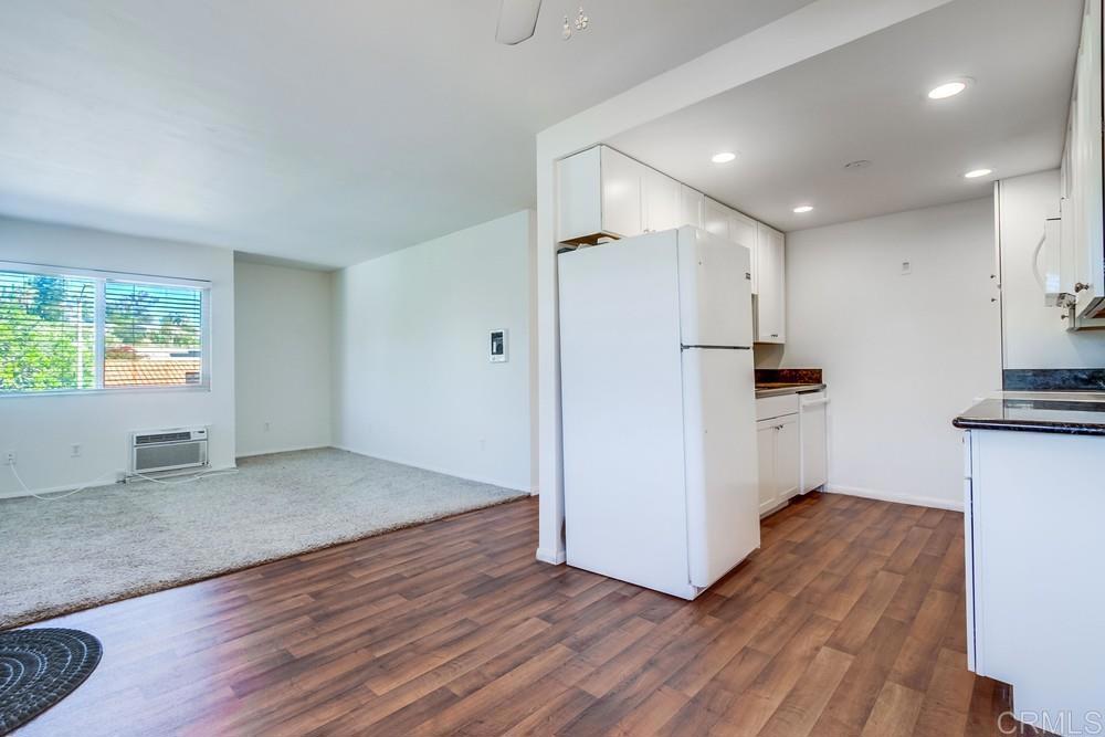 12643 Robison Boulevard, Unit 213 Poway, CA 92064 - Photo 15 of 49 a view of kitchen with wooden floor and electronic appliances