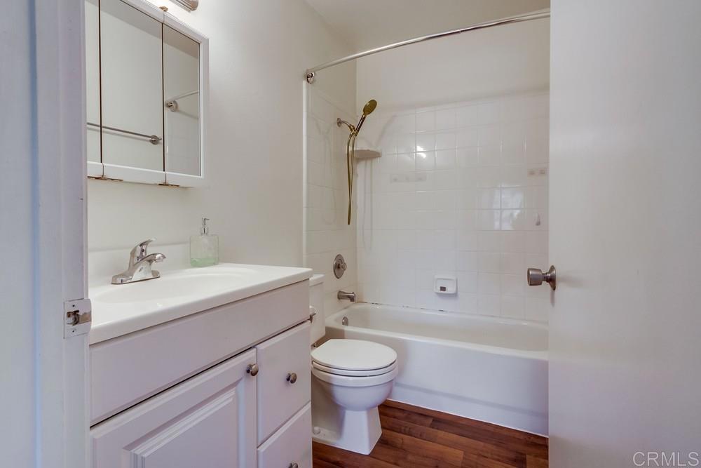 12643 Robison Boulevard, Unit 213 Poway, CA 92064 - Photo 27 of 49 a bathroom with a sink a toilet and shower