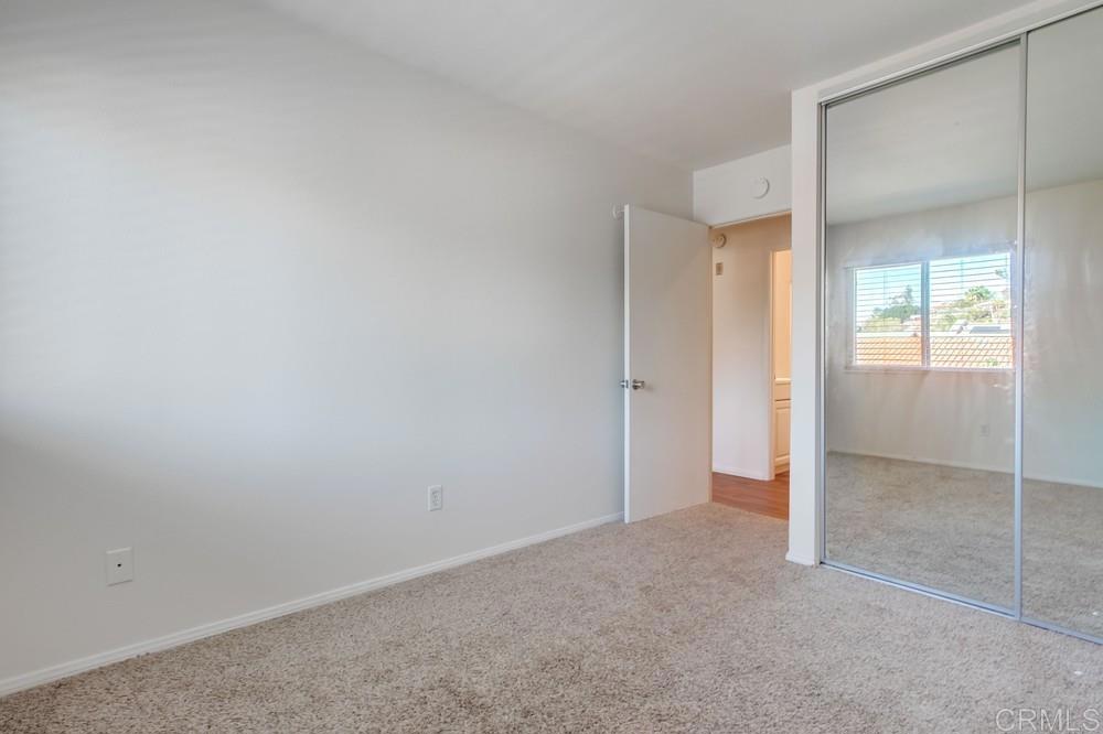 12643 Robison Boulevard, Unit 213 Poway, CA 92064 - Photo 30 of 49 an empty room with window in back and closet area