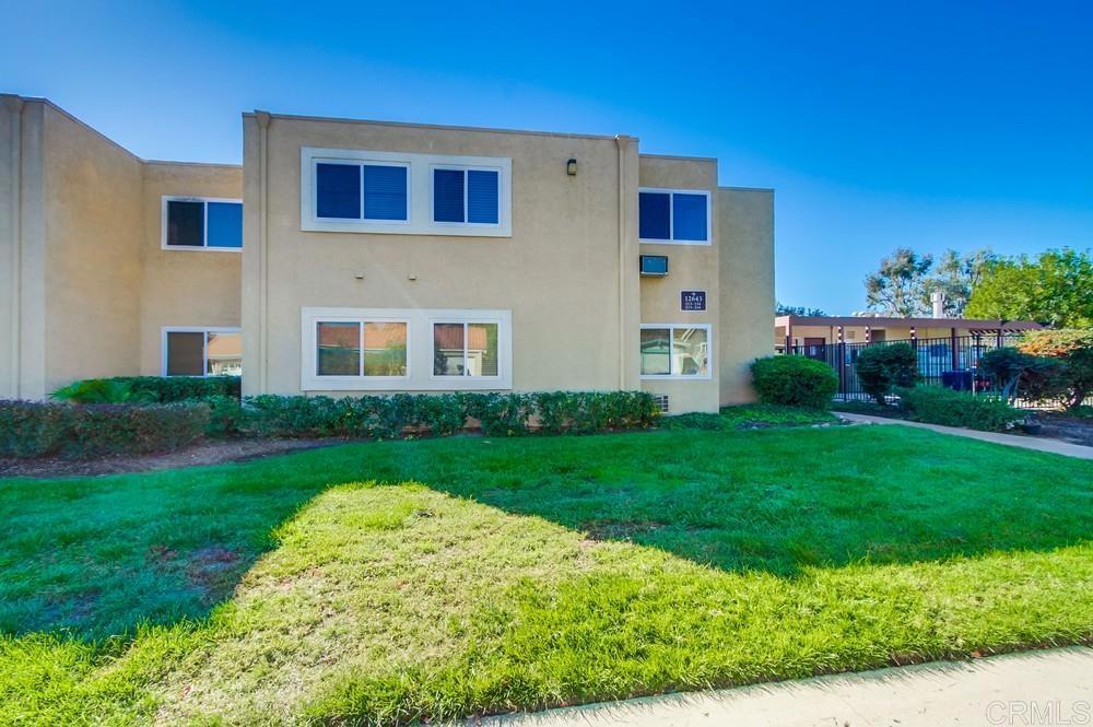 12643 Robison Boulevard, Unit 213 Poway, CA 92064 - Photo 3 of 49 a front view of a house with garden