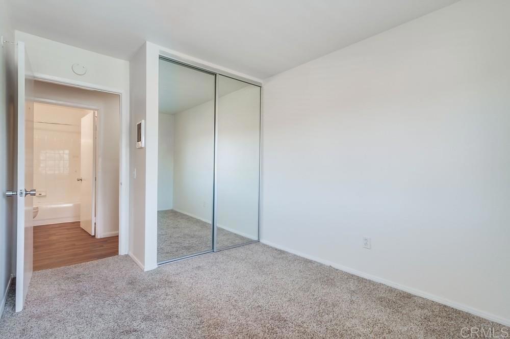 12643 Robison Boulevard, Unit 213 Poway, CA 92064 - Photo 31 of 49 an empty room with closet and a bathroom