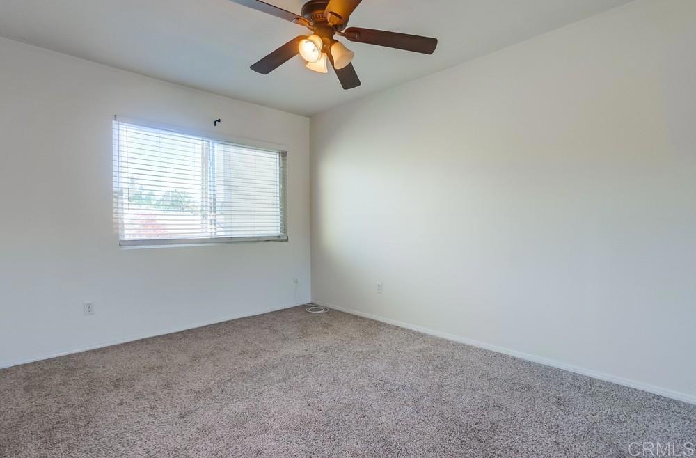12643 Robison Boulevard, Unit 213 Poway, CA 92064 - Photo 36 of 49 an empty room with windows and fan