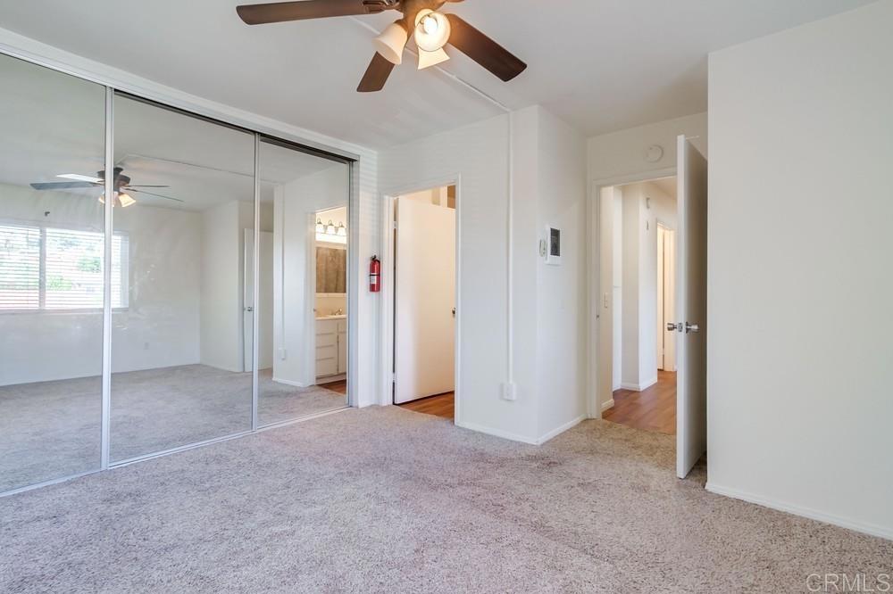 12643 Robison Boulevard, Unit 213 Poway, CA 92064 - Photo 39 of 49 an empty room with closet and a chandelier fan