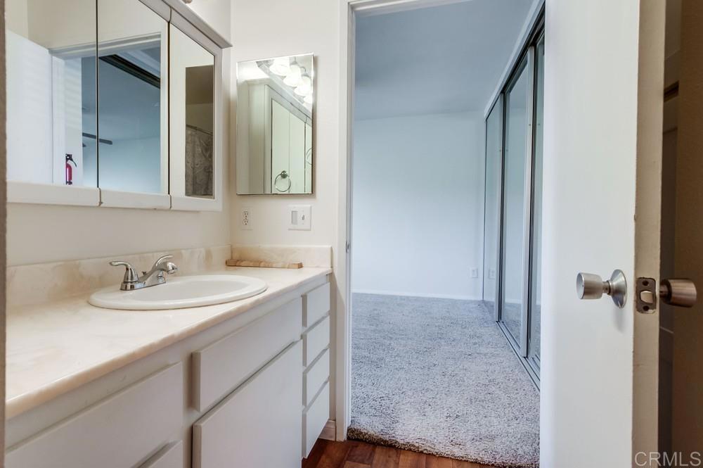 12643 Robison Boulevard, Unit 213 Poway, CA 92064 - Photo 42 of 49 a bathroom with a sink and a mirror