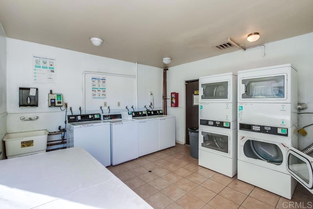 12643 Robison Boulevard, Unit 213 Poway, CA 92064 - Photo 45 of 49 a kitchen with a refrigerator and stove top oven