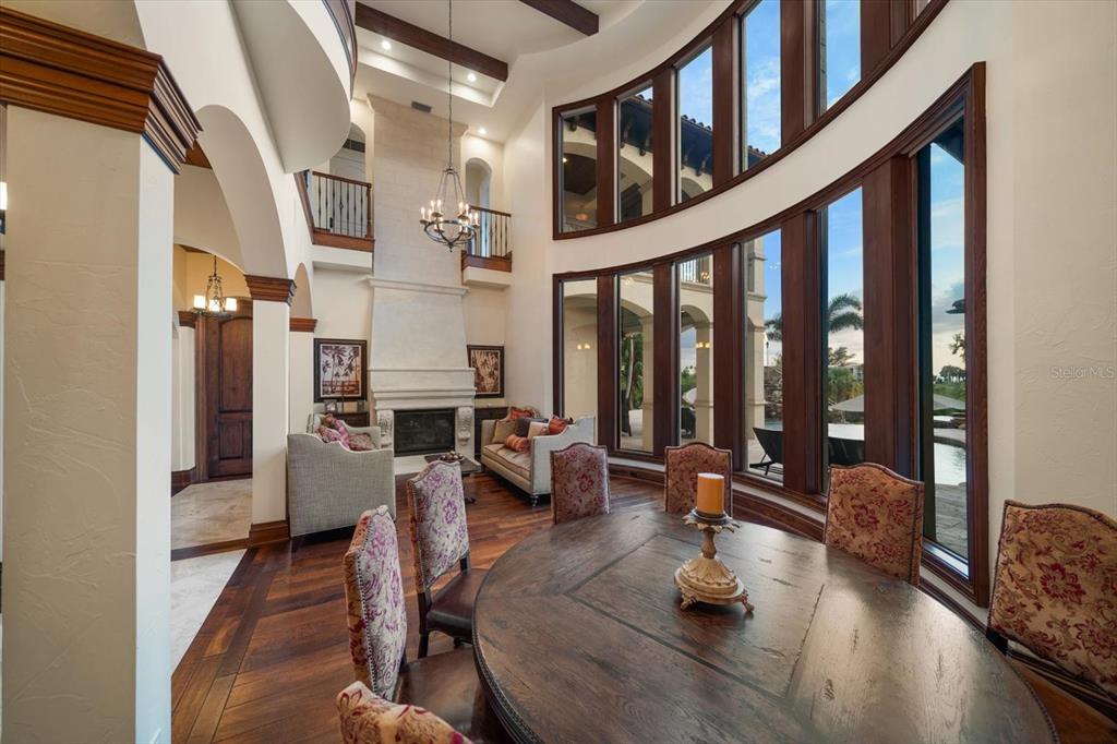 10930 Spring Street Largo, FL 33774 - Photo 14 of 100 a living room with furniture stairs and a large window