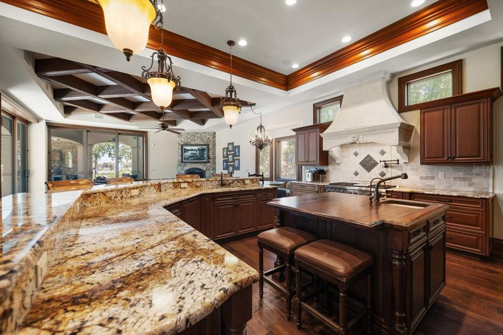 10930 Spring Street Largo, FL 33774 - Photo 17 of 100 a kitchen with stainless steel appliances granite countertop a sink and a microwave