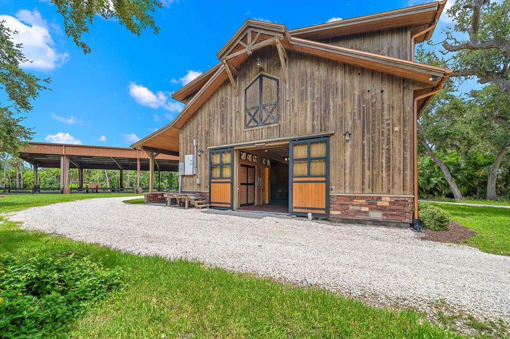 10930 Spring Street Largo, FL 33774 - Photo 2 of 100 a front view of a house with garden