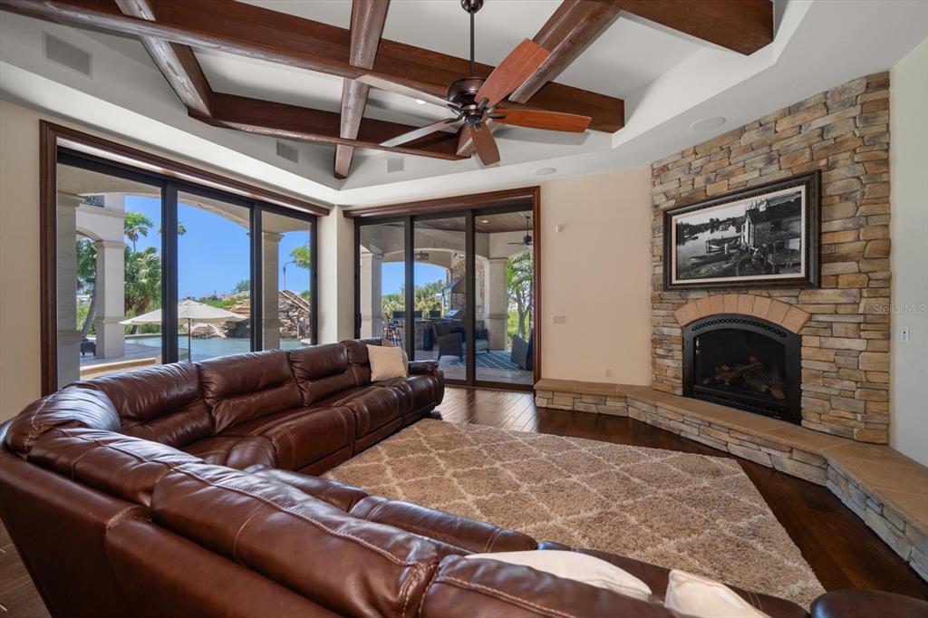 10930 Spring Street Largo, FL 33774 - Photo 22 of 100 a living room with furniture large window and a fireplace
