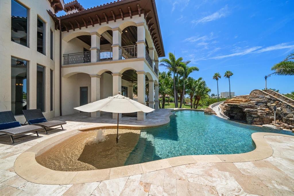 10930 Spring Street Largo, FL 33774 - Photo 24 of 100 a swimming pool with outdoor seating and yard