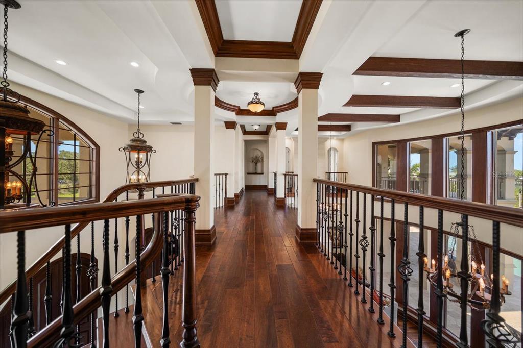 10930 Spring Street Largo, FL 33774 - Photo 33 of 100 a view of a hallway with wooden floor and stairs