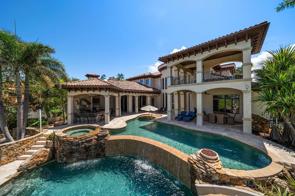10930 Spring Street Largo, FL 33774 - Photo 44 of 100 a front view of house with yard and outdoor seating
