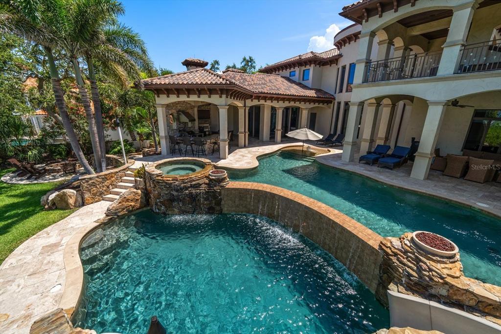 10930 Spring Street Largo, FL 33774 - Photo 45 of 100 a front view of a house with garden and sitting area