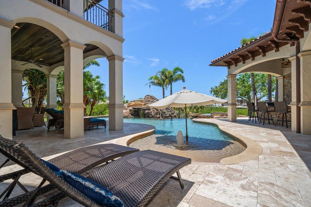 10930 Spring Street Largo, FL 33774 - Photo 46 of 100 a view of a patio with table and chairs potted plants with wooden floor