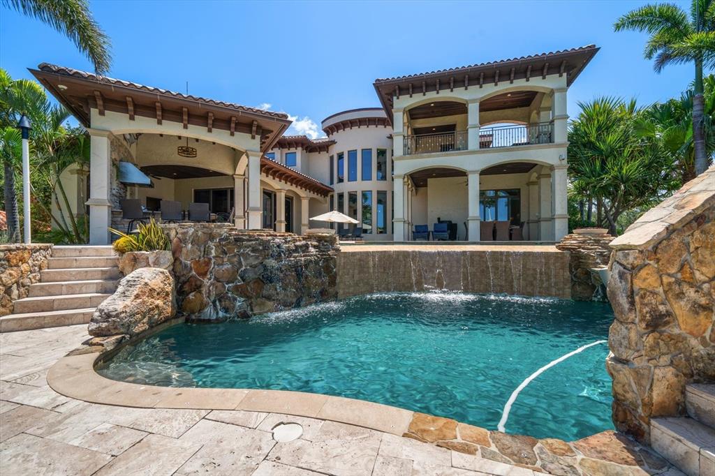 10930 Spring Street Largo, FL 33774 - Photo 50 of 100 a view of a house with a yard