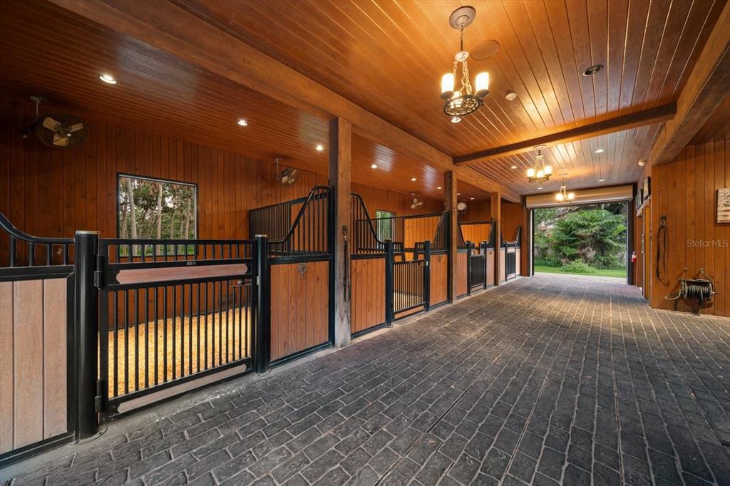 10930 Spring Street Largo, FL 33774 - Photo 5 of 100 a view of a porch with a table and chairs