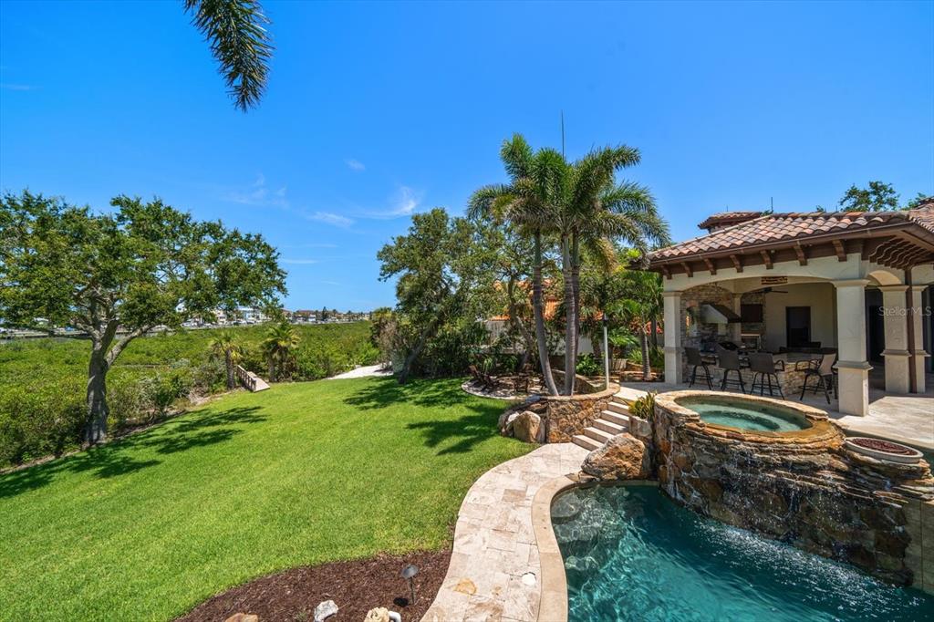 10930 Spring Street Largo, FL 33774 - Photo 53 of 100 a view of a house with backyard outdoor seating and hardwood