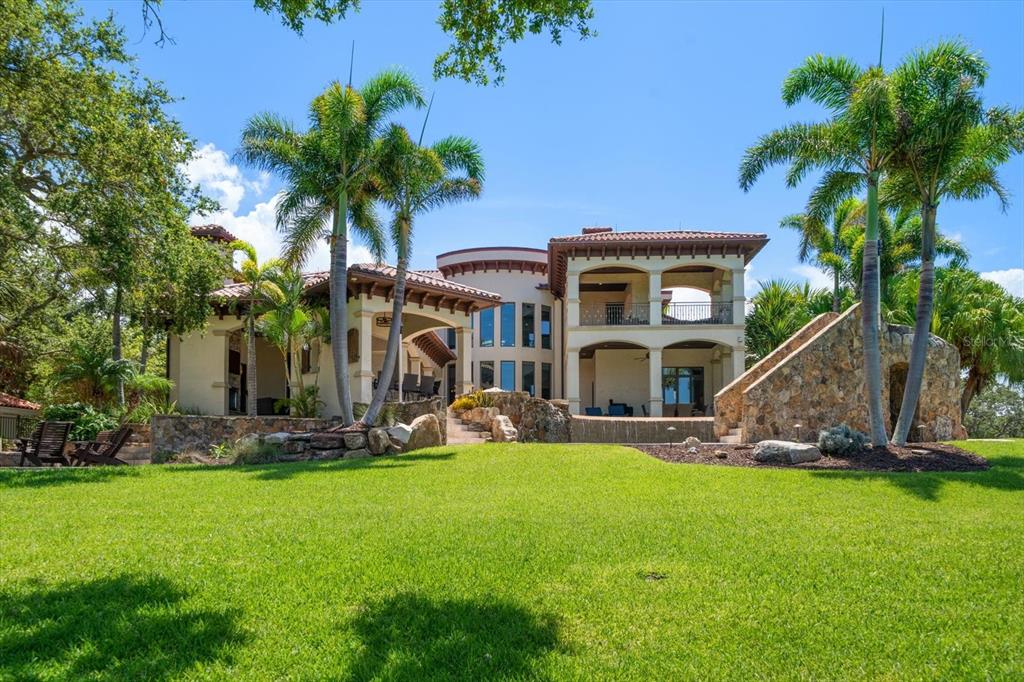 10930 Spring Street Largo, FL 33774 - Photo 53 of 100 a front view of a house with garden