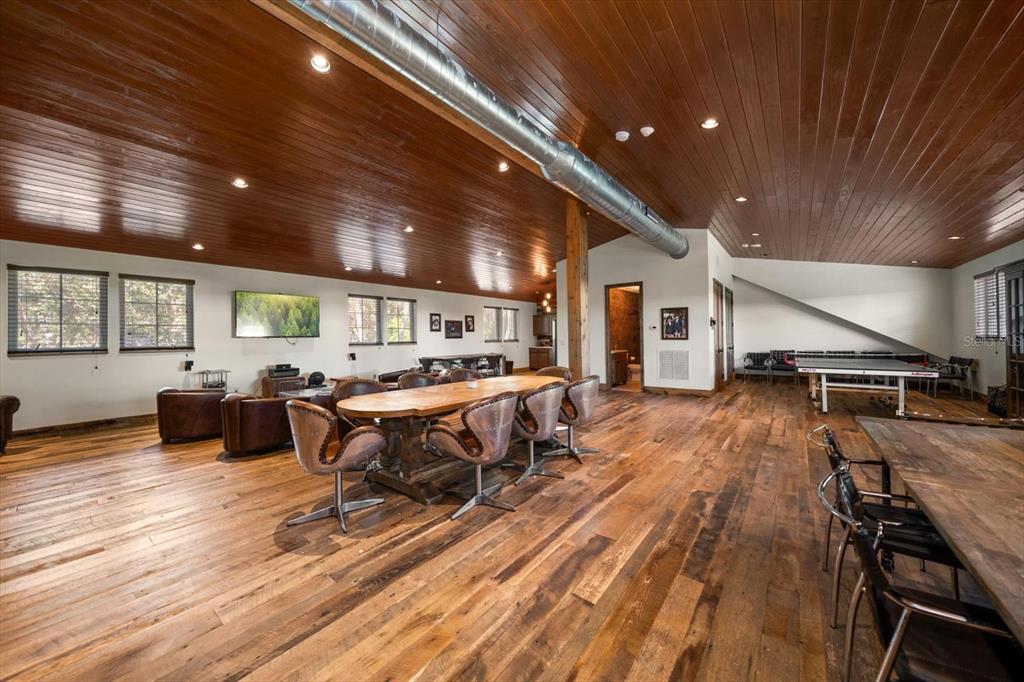 10930 Spring Street Largo, FL 33774 - Photo 68 of 100 a living room with furniture a wooden floor and pool table