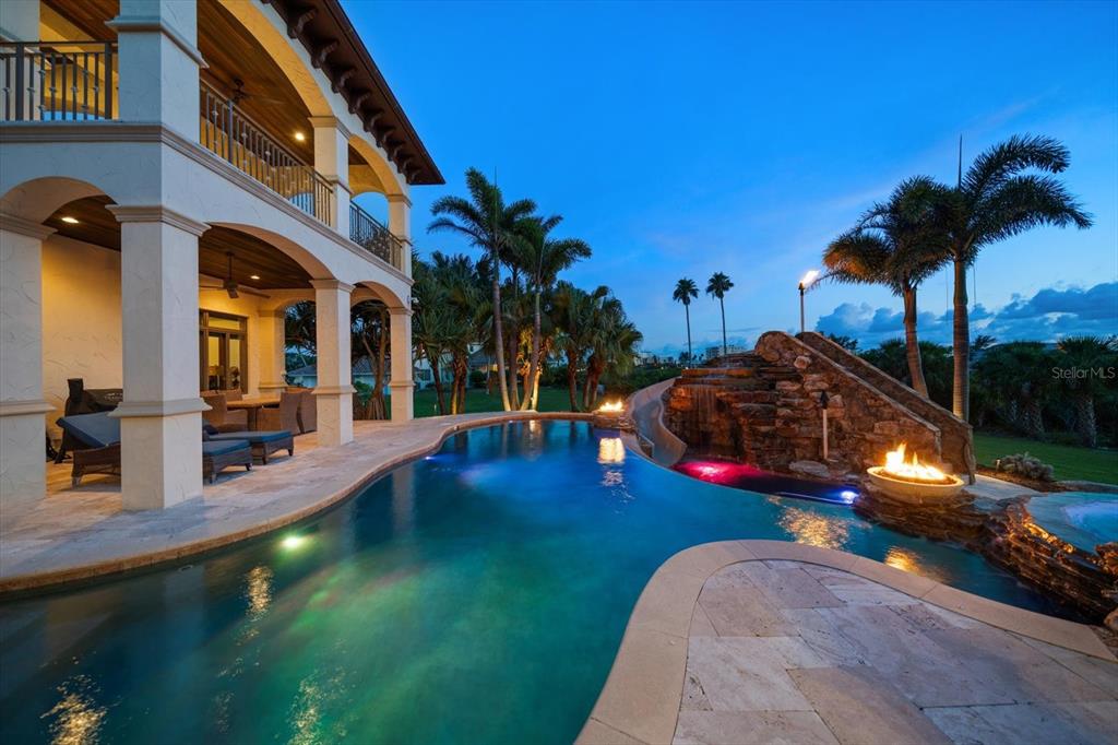 10930 Spring Street Largo, FL 33774 - Photo 87 of 100 a view of a swimming pool with an outdoor space and seating area