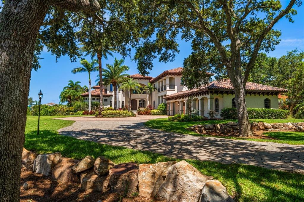 10930 Spring Street Largo, FL 33774 - Photo 88 of 100 a front view of a house with garden