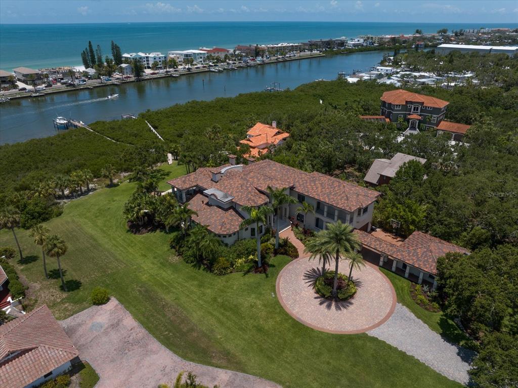 10930 Spring Street Largo, FL 33774 - Photo 96 of 100 an aerial view of residential houses with outdoor space and lake view