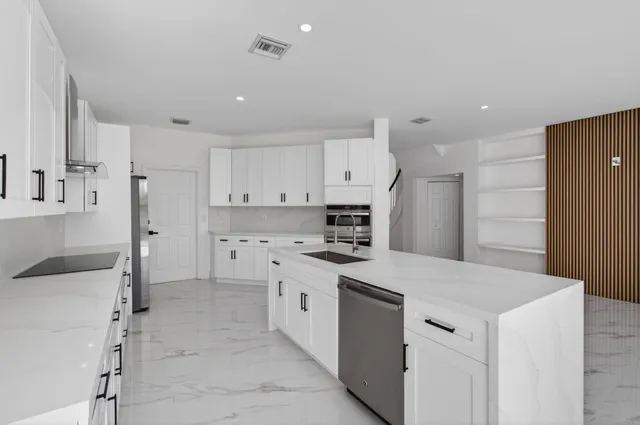 a living room with furniture and large windows