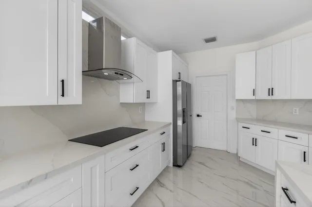 a view of a porch with wooden floor and front door