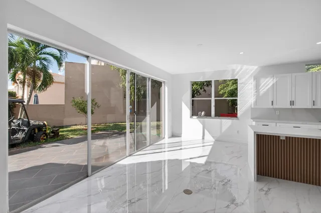 a bathroom with double sink and mirror with bathtub