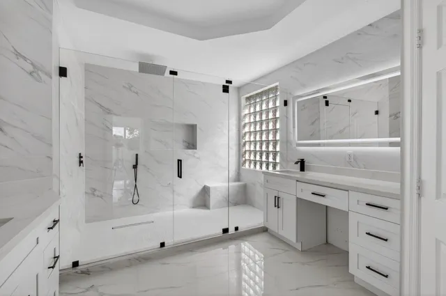 an entryway with wooden floor and windows