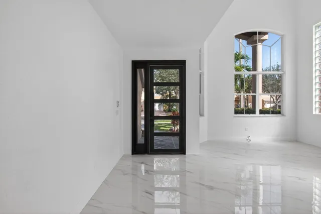 a view of an empty room with windows