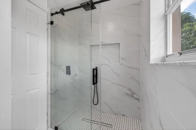 a view of a house with backyard sitting area and garden