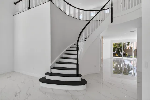a large bathroom with a large tub and sink