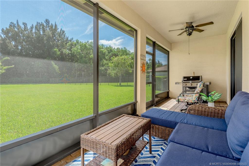 5891 Southeast Entry Court Stuart, FL 34997 - Photo 17 of 29 a view of an outdoor sitting area with furniture