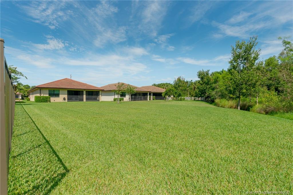 5891 Southeast Entry Court Stuart, FL 34997 - Photo 18 of 29 a view of an house with backyard space and balcony