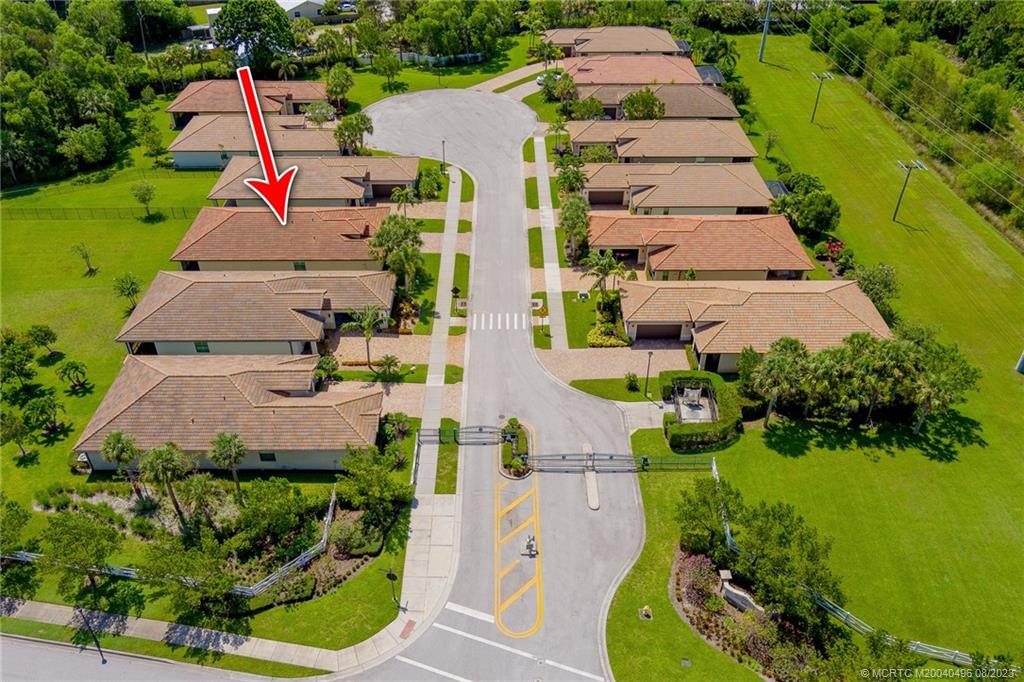 5891 Southeast Entry Court Stuart, FL 34997 - Photo 23 of 29 an aerial view of multiple houses with yard