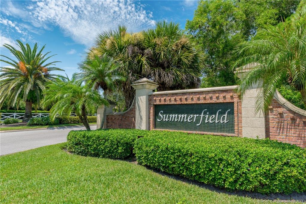 5891 Southeast Entry Court Stuart, FL 34997 - Photo 24 of 29 a sign on the side of the road