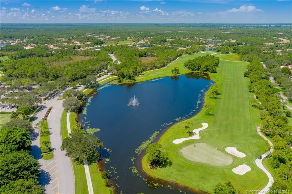 5891 Southeast Entry Court Stuart, FL 34997 - Photo 26 of 29 an aerial view of residential houses with outdoor space and swimming pool