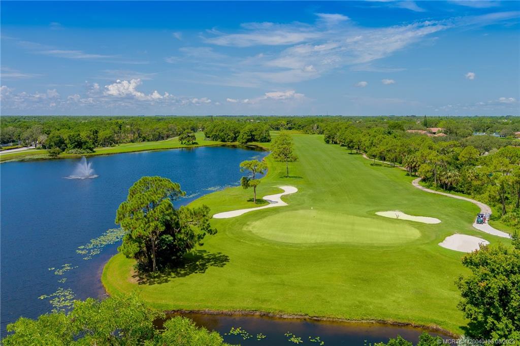 5891 Southeast Entry Court Stuart, FL 34997 - Photo 27 of 29 a view of a lake from a yard
