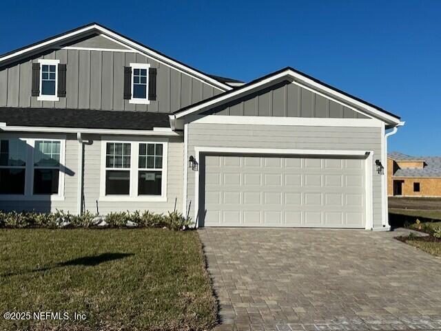 156 Camphor Laurel Road St. Augustine, FL 32092 - Photo 1 of 34 a front view of a house with a yard