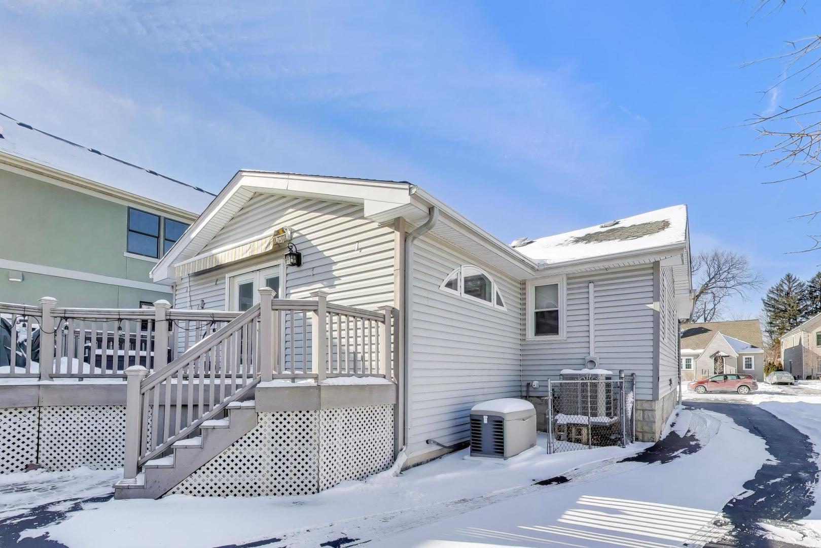 365 Walnut Street Elmhurst, IL 60126 - Photo 15 of 19 a view of a patio with couches table and chairs and potted plants