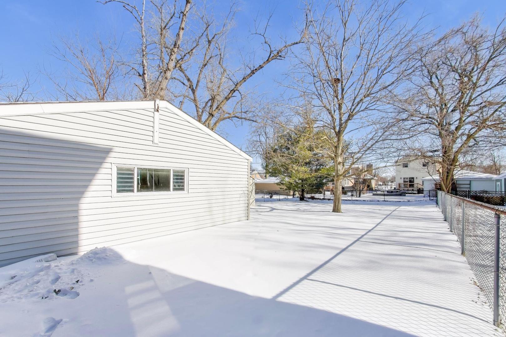 365 Walnut Street Elmhurst, IL 60126 - Photo 16 of 19 a house with trees in front of it