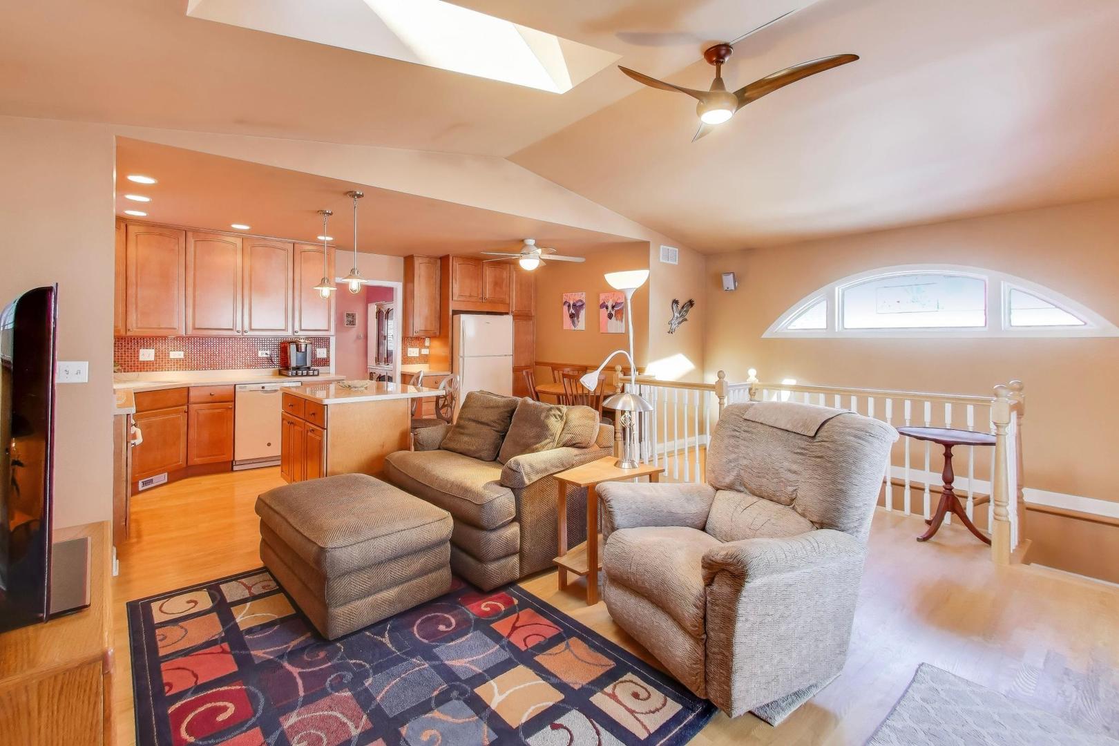 365 Walnut Street Elmhurst, IL 60126 - Photo 4 of 19 a living room with furniture and a view of kitchen