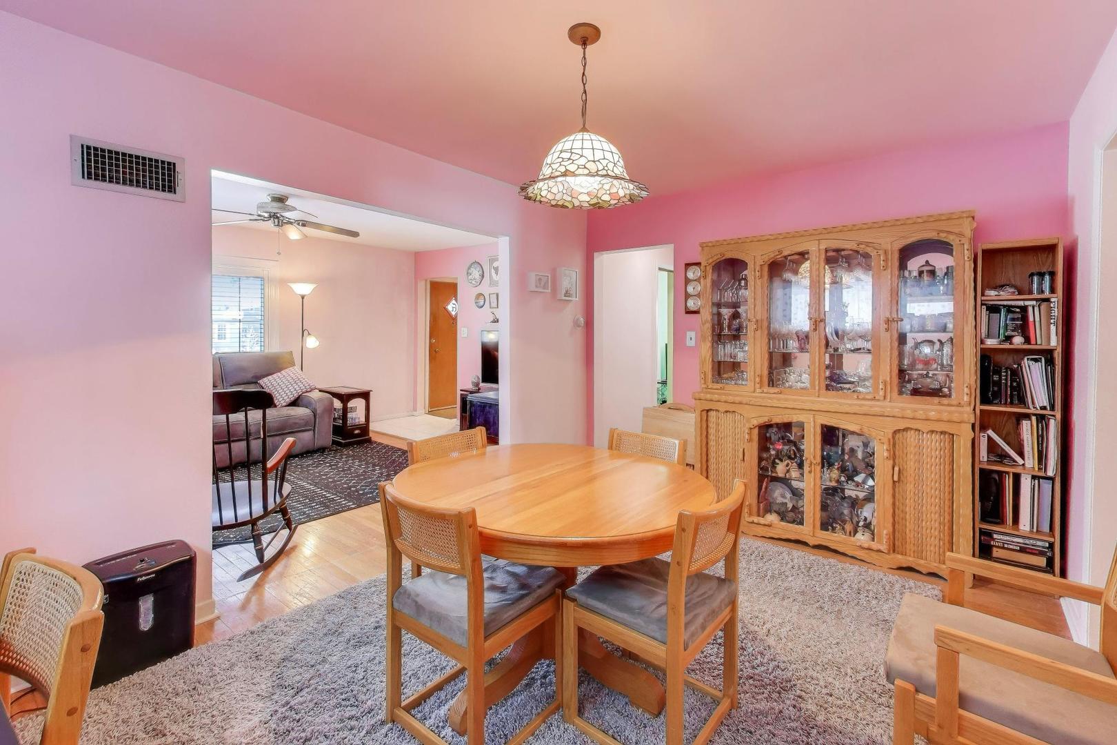 365 Walnut Street Elmhurst, IL 60126 - Photo 8 of 19 a view of a dining room with furniture and chandelier
