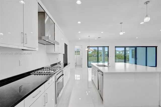 a bathroom with a sink a toilet and a shower