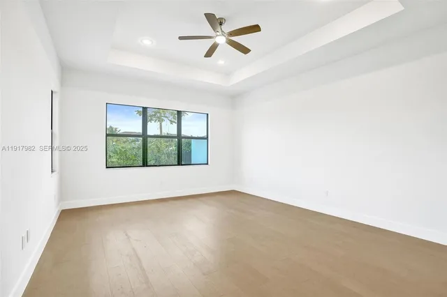 a view of a lake with houses in the background