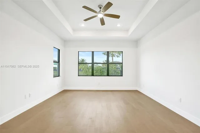 a view of a lake with houses in the back