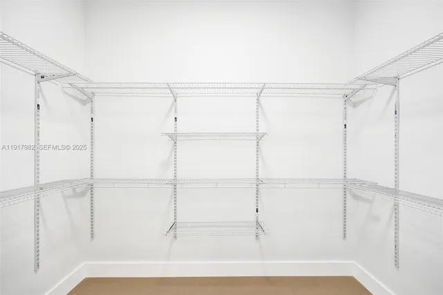 a lobby with furniture and floor to ceiling window