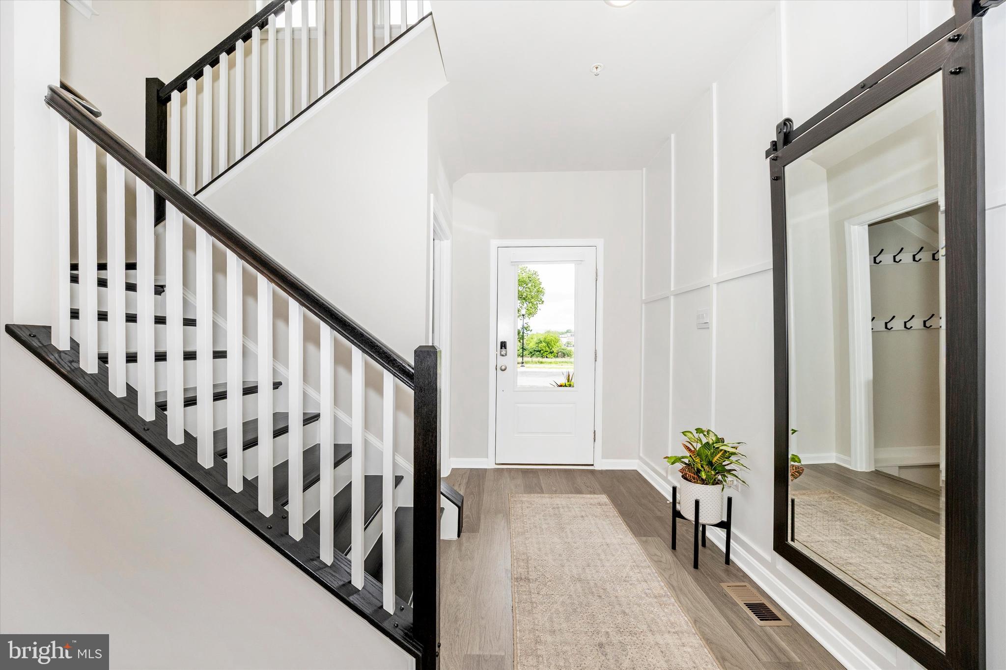 700 Bond Street Frederick, MD 21701 - Photo 3 of 49 a view of entryway with wooden floor and stairs